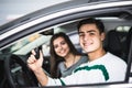 Young couple with keys to new car Royalty Free Stock Photo