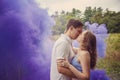 Couple kissing in purple smoke Royalty Free Stock Photo