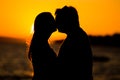 Young couple kissing on the beach sunset Royalty Free Stock Photo