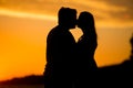 Young couple kissing on the beach sunset Royalty Free Stock Photo