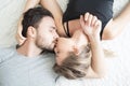 Young couple kissing in the bed .loving couple in bedroom.. Royalty Free Stock Photo