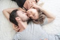 Young couple kissing in the bed .loving couple in bedroom. Royalty Free Stock Photo