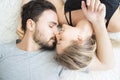 Young couple kissing in the bed .loving couple in bedroom. Royalty Free Stock Photo