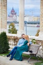 Young couple kissing on bench near the columns of Budapest Royalty Free Stock Photo