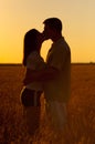 Young couple kissing in the field of wheat Royalty Free Stock Photo