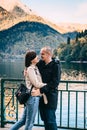 Young couple kissing and hugging near the lake in the mountains. Royalty Free Stock Photo