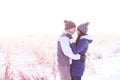 Young couple kissing nature in winter