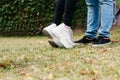 Young couple kissing outdoors. Close-up of the feet of two people in love with plenty of copy space Royalty Free Stock Photo