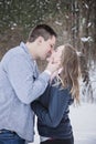 Young couple kissing outdoors in winter