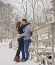 Young couple kissing outdoors in winter Royalty Free Stock Photo