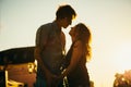 Young couple kissing over sunset Royalty Free Stock Photo