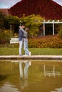Young couple kissing and rejoices at the lake. lovely young couple kissing outdoors in autumn. Loving couple walking in Royalty Free Stock Photo