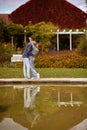 Young couple kissing and rejoices at the lake. lovely young couple kissing outdoors in autumn. Loving couple walking in Royalty Free Stock Photo