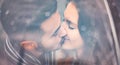Young couple kissing under umbrella in rainy day - Romantic lovers having a tender moment outdoor Royalty Free Stock Photo