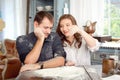 Young couple in the kitchen playing with flour. Funny moments, smiles, cooking, Happy together, memories. Royalty Free Stock Photo