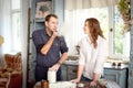 Young couple in the kitchen playing with flour. Funny moments, smiles, cooking, Happy together, memories. Royalty Free Stock Photo