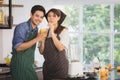 YOUNG COUPLE IN KITCHEN Royalty Free Stock Photo