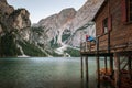 Young couple on lago di braies in italien dolomites, travel and adventure photography