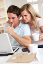 Young couple at a laptop computer Royalty Free Stock Photo