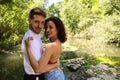 Young couple of Latin dancers, handsome and in love are walking in the park while showing their love. Woman and man are happy, in Royalty Free Stock Photo