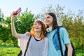 Young couple, laughing teenagers taking selfie photo on smartphone Royalty Free Stock Photo