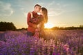 Young couple in a lavender field at sunset Royalty Free Stock Photo