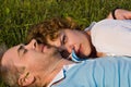 Young couple lies on a grass