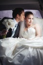 Young couple in limo kissing Royalty Free Stock Photo