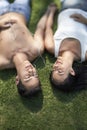 Young Couple Listening Music On Grass Royalty Free Stock Photo
