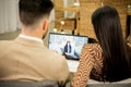 Young couple listening to family psychologist during online session Royalty Free Stock Photo