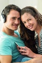 Young couple listening to music on mobile phone Royalty Free Stock Photo