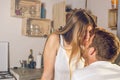 Young couple looking at each other and kissing in the kitchen happy Royalty Free Stock Photo