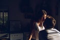 Young couple looking at each other and kissing in the kitchen happy Royalty Free Stock Photo