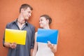 Young couple looking into eyes and holding frames background Royalty Free Stock Photo