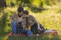 young couple looking at photos on a camera Royalty Free Stock Photo