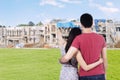 Young couple looking at residential construction Royalty Free Stock Photo