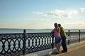 Young couple looking at river