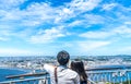 Young couple looking at the view of enoshima