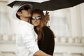 Young fashion couple in love with umbrella