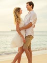 Young couple in love on the beach sunset Royalty Free Stock Photo