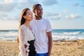 Young couple in love on the beach together. Royalty Free Stock Photo