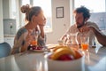 A young couple in love chatting while having a breakfast at home. Relationship, love, together, breakfast Royalty Free Stock Photo