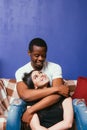 Young couple in love, cuddle and caress at home