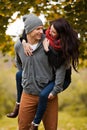 Young couple in love frolicking in a park Royalty Free Stock Photo