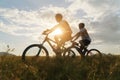 Young Couple in love fun and happy riding mountain bike after covid-19 coronavirus outbreak. End of the coronavirus outbreak. Royalty Free Stock Photo