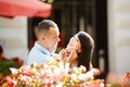 Young couple in love having fun, laughing and smiling outdoor, spring sunny portrait, embrace, happy smiling girl