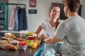 A young couple in love having a lovely chat during a breakfast at home. Couple, love, breakfast, together Royalty Free Stock Photo