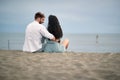Young couple in love having romantic tender moments on the beach