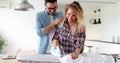 Young couple at home doing hosehold chores and ironing Royalty Free Stock Photo