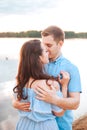 Young couple in love hug each other at the lake outdoor in summer day, , harmony concept Royalty Free Stock Photo